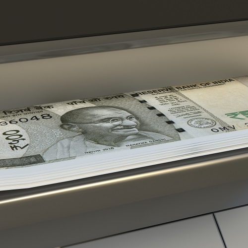 500 Indian rupees  in cash dispenser. Withdrawal of cash from an ATM.